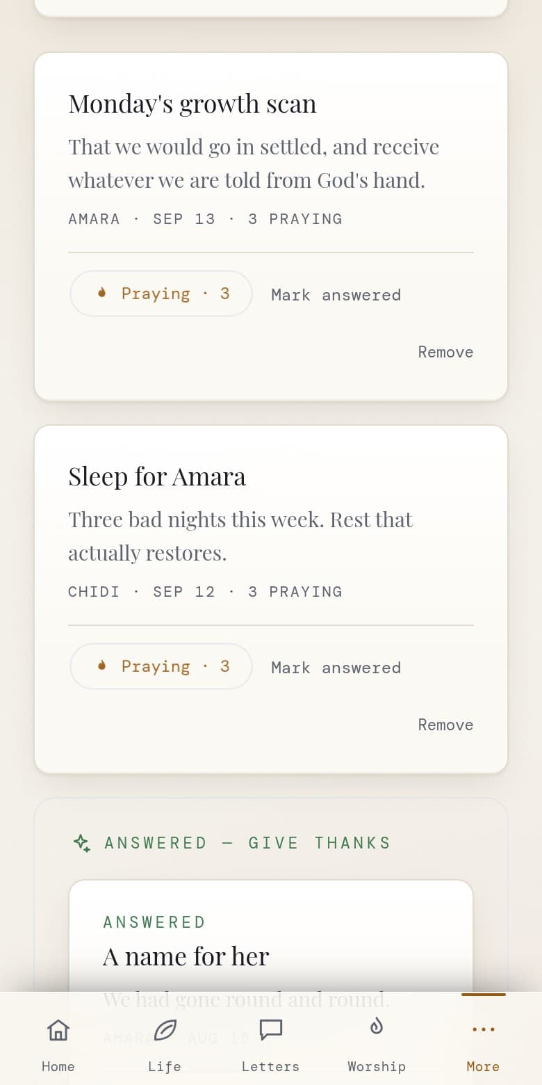 The prayer wall on a phone, with two requests a family is carrying, each showing who asked, when, and how many people are praying, above a section of requests that have been answered.